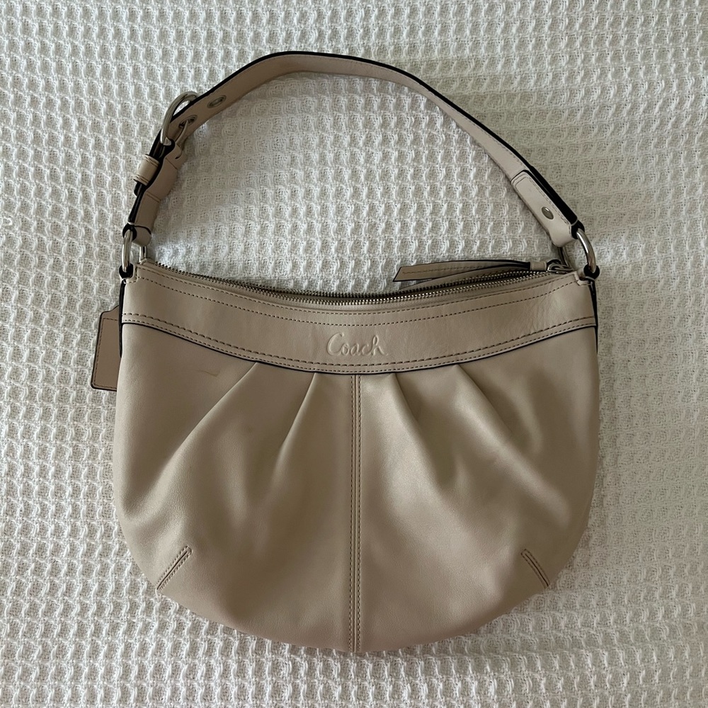 COACH handbag. Cream leather with tan lining. Silver hardware.